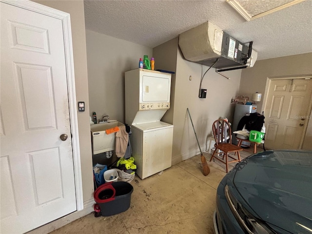 131 49th Ct E, Palmetto, FL 34221 - laundry area with stacked washer / dryer and a textured ceiling