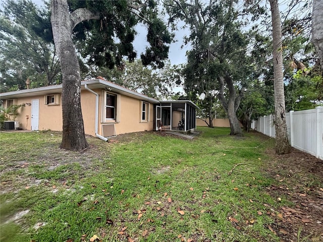 131 49th Ct E, Palmetto, FL 34221 - fenced yard with a sunroom