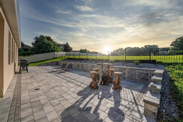 30120 Hackney Loop, Mount Dora, FL 32757 - patio terrace at dusk featuring a patio and a fenced backyard