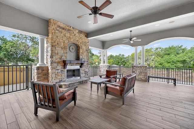 30120 Hackney Loop, Mount Dora, FL 32757 - wooden terrace featuring ceiling fan and an outdoor living space with a fireplace