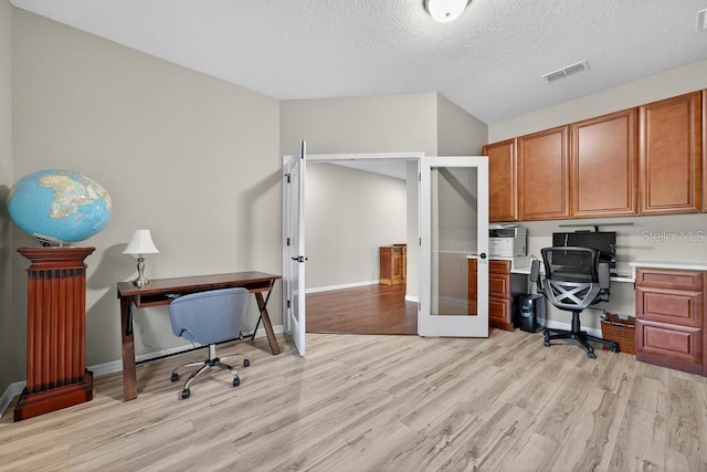 30120 Hackney Loop, Mount Dora, FL 32757 - office space with french doors, light wood-type flooring, and a textured ceiling