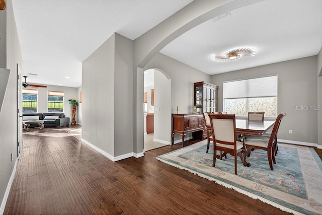 30120 Hackney Loop, Mount Dora, FL 32757 - dining area with arched walkways and wood finished floors