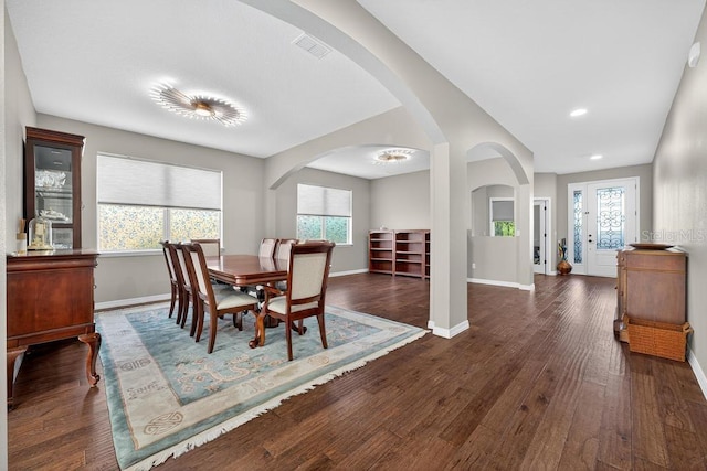 30120 Hackney Loop, Mount Dora, FL 32757 - dining area featuring wood finished floors, arched walkways, and recessed lighting