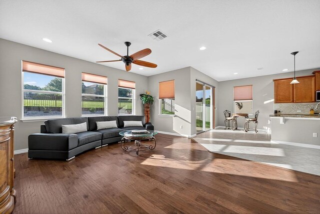 30120 Hackney Loop, Mount Dora, FL 32757 - living room with plenty of natural light, ceiling fan, recessed lighting, and dark wood finished floors