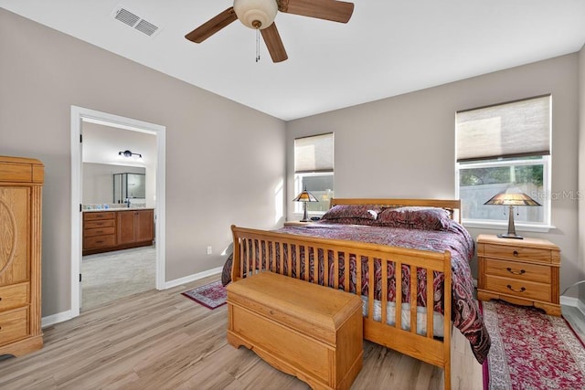 30120 Hackney Loop, Mount Dora, FL 32757 - bedroom featuring light wood-style flooring, ceiling fan, and ensuite bath