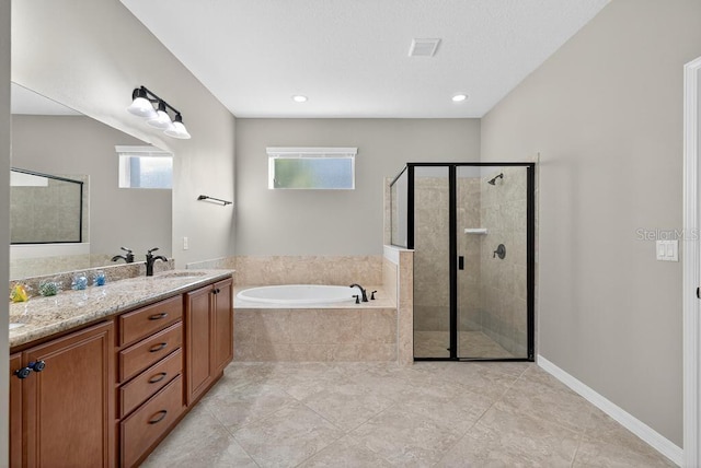 30120 Hackney Loop, Mount Dora, FL 32757 - bathroom with a bath, a stall shower, tile patterned floors, and double vanity
