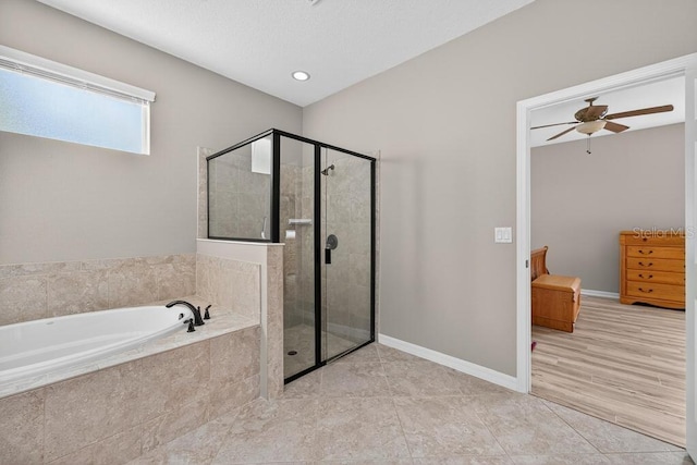 30120 Hackney Loop, Mount Dora, FL 32757 - bathroom with a bath, a stall shower, tile patterned floors, and a ceiling fan