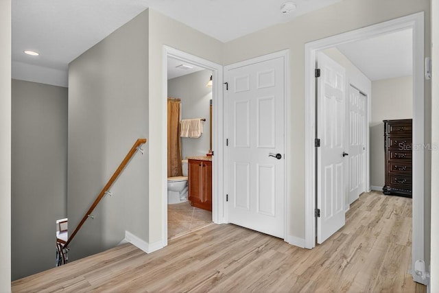 30120 Hackney Loop, Mount Dora, FL 32757 - corridor featuring an upstairs landing, light wood-style floors, and recessed lighting