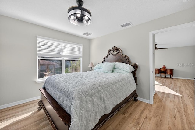 30120 Hackney Loop, Mount Dora, FL 32757 - bedroom with light wood-style flooring