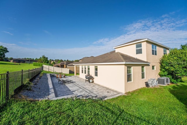 30120 Hackney Loop, Mount Dora, FL 32757 - rear view of house with stucco siding, a fenced backyard, and a patio area