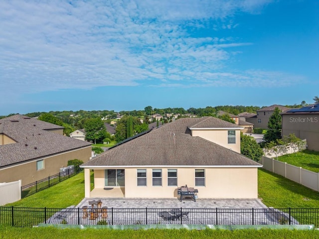 30120 Hackney Loop, Mount Dora, FL 32757 - back of property featuring a patio, stucco siding, roof with shingles, a residential view, and a fenced backyard