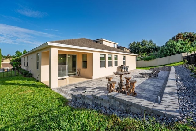 30120 Hackney Loop, Mount Dora, FL 32757 - back of house featuring stucco siding, a patio area, a fenced backyard, and roof with shingles