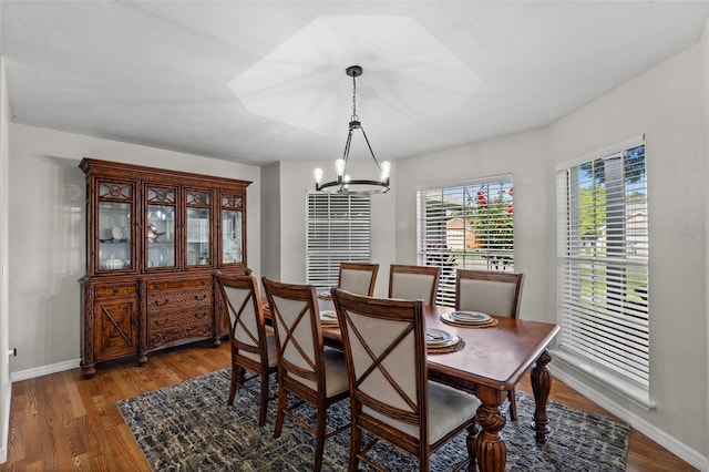 5949 Broken Bow Ln, Port Orange, FL 32127 - dining space with a chandelier and wood finished floors