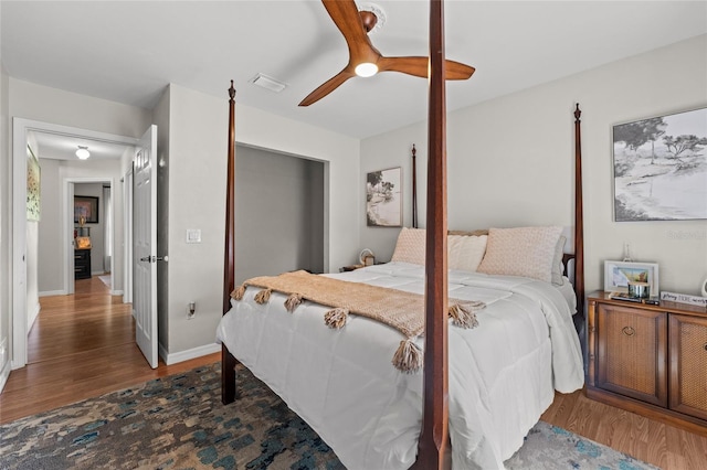 5949 Broken Bow Ln, Port Orange, FL 32127 - bedroom with wood finished floors, a closet, and a ceiling fan