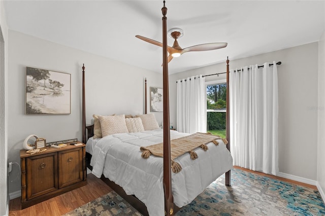 5949 Broken Bow Ln, Port Orange, FL 32127 - bedroom with wood finished floors, ceiling fan, and access to outside