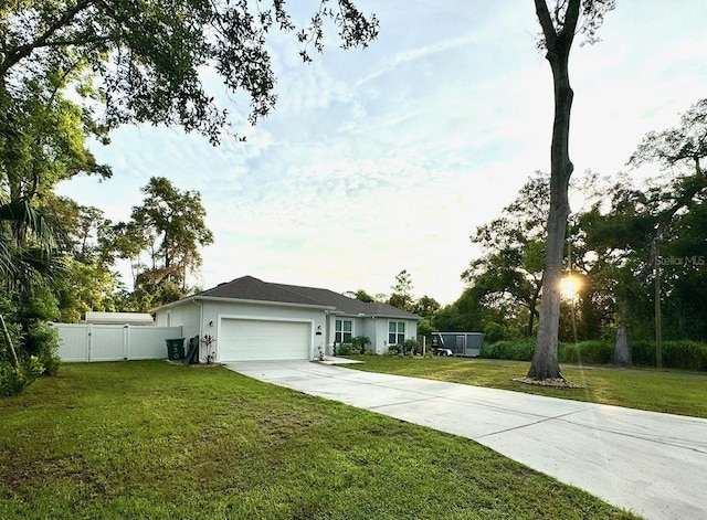 430 Baker Ave, Lake Helen, FL 32744 - ranch-style home with an attached garage and driveway