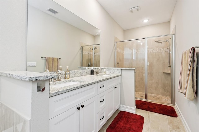 430 Baker Ave, Lake Helen, FL 32744 - bathroom with a shower stall and double vanity