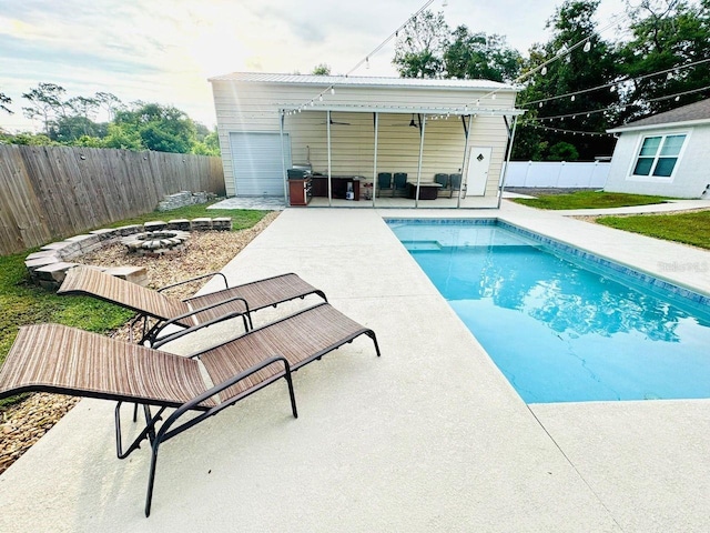 430 Baker Ave, Lake Helen, FL 32744 - view of swimming pool featuring a patio area, a fenced backyard, and an outdoor fire pit