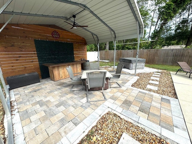 430 Baker Ave, Lake Helen, FL 32744 - fenced backyard featuring a hot tub, a patio, a ceiling fan, and outdoor dining space