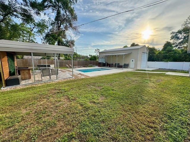 430 Baker Ave, Lake Helen, FL 32744 - fenced backyard with a patio area and an outbuilding