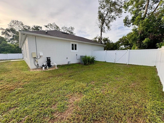 430 Baker Ave, Lake Helen, FL 32744 - rear view of property featuring a fenced backyard, a gate, and stucco siding