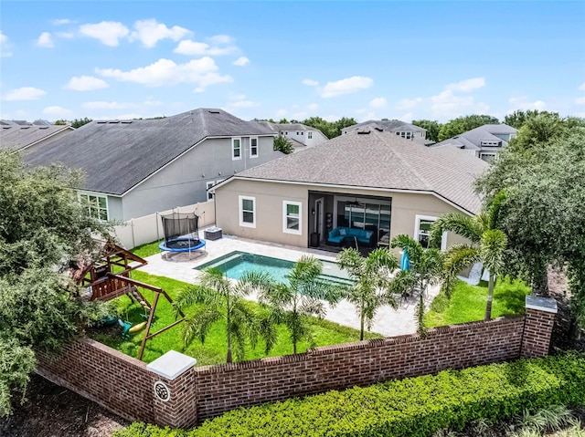 14903 Ellingsworth Ln, Winter Garden, FL 34787 - rear view of house featuring stucco siding, a patio, a ceiling fan, and roof with shingles