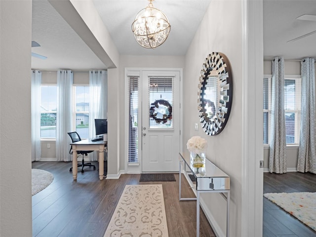14903 Ellingsworth Ln, Winter Garden, FL 34787 - foyer entrance featuring a chandelier and dark wood-style flooring