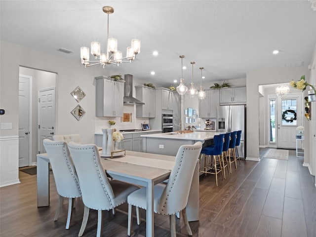 14903 Ellingsworth Ln, Winter Garden, FL 34787 - dining room with a chandelier, dark wood-style flooring, and recessed lighting