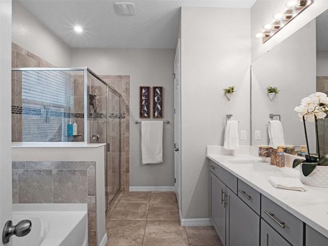 14903 Ellingsworth Ln, Winter Garden, FL 34787 - bathroom with double vanity, a shower stall, and a garden tub