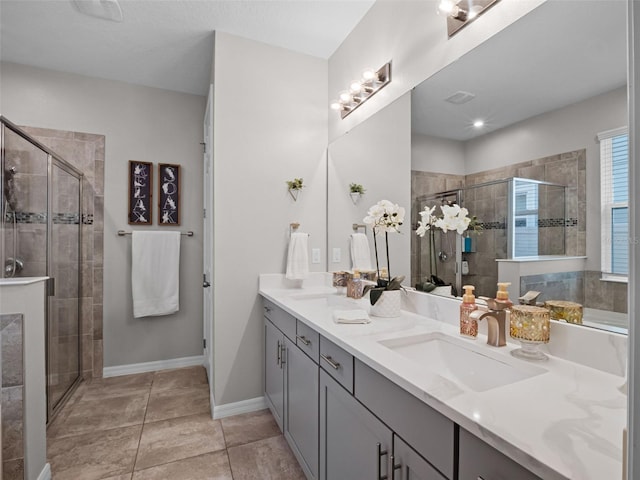 14903 Ellingsworth Ln, Winter Garden, FL 34787 - bathroom featuring double vanity, a shower stall, and tile patterned floors