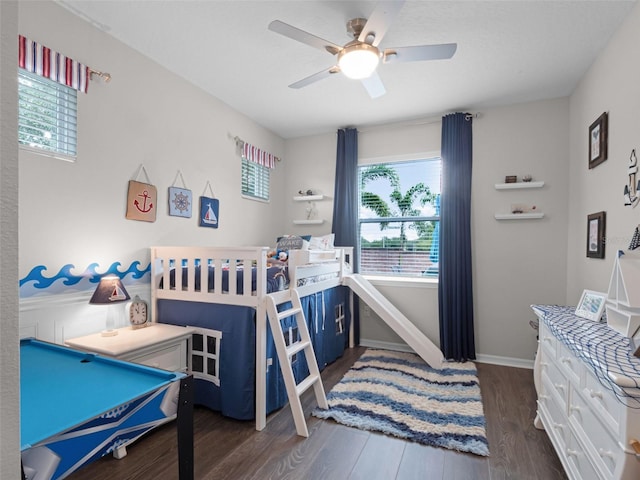 14903 Ellingsworth Ln, Winter Garden, FL 34787 - bedroom with dark wood finished floors and ceiling fan