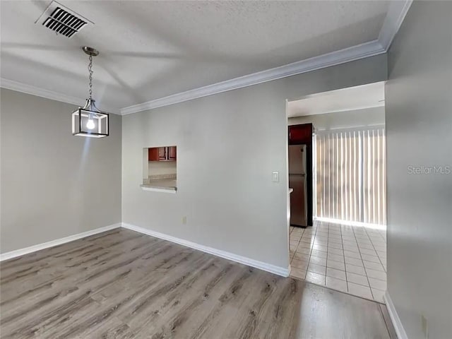 1709 Shady Ridge Ct Unit 243, Orlando, FL 32807 - empty room featuring crown molding and wood finished floors