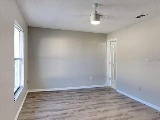 1709 Shady Ridge Ct Unit 243, Orlando, FL 32807 - spare room featuring ceiling fan and light wood-style flooring