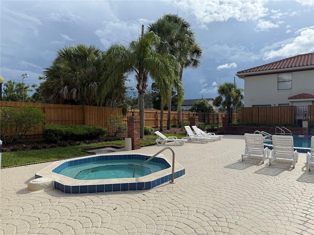 1709 Shady Ridge Ct Unit 243, Orlando, FL 32807 - view of pool with a community hot tub and a patio area