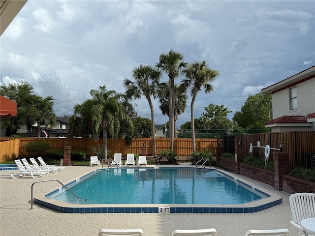 1709 Shady Ridge Ct Unit 243, Orlando, FL 32807 - community pool featuring a fenced backyard and a patio