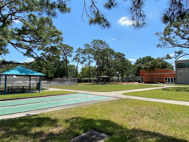 1709 Shady Ridge Ct Unit 243, Orlando, FL 32807 - view of community with a yard, shuffleboard, and a gazebo
