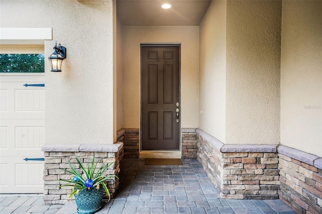 7540 Bishop Square Dr, Winter Garden, FL 34787 - entrance to property featuring stucco siding and stone siding