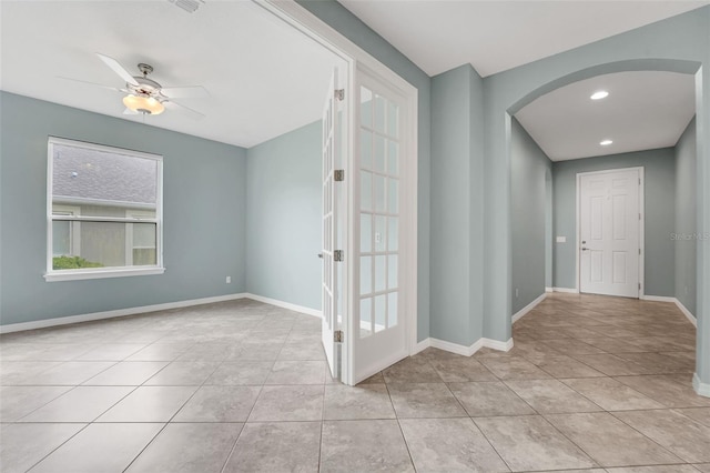 7540 Bishop Square Dr, Winter Garden, FL 34787 - tiled empty room with arched walkways, a ceiling fan, and recessed lighting