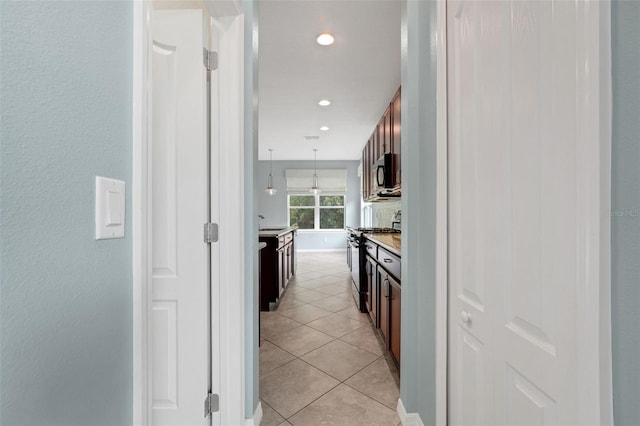 7540 Bishop Square Dr, Winter Garden, FL 34787 - hall with light tile patterned floors and recessed lighting