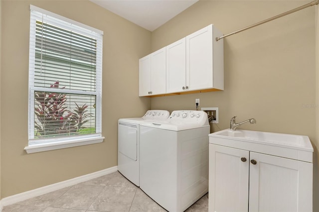7540 Bishop Square Dr, Winter Garden, FL 34787 - laundry area with cabinet space, washing machine and dryer, and light tile patterned flooring