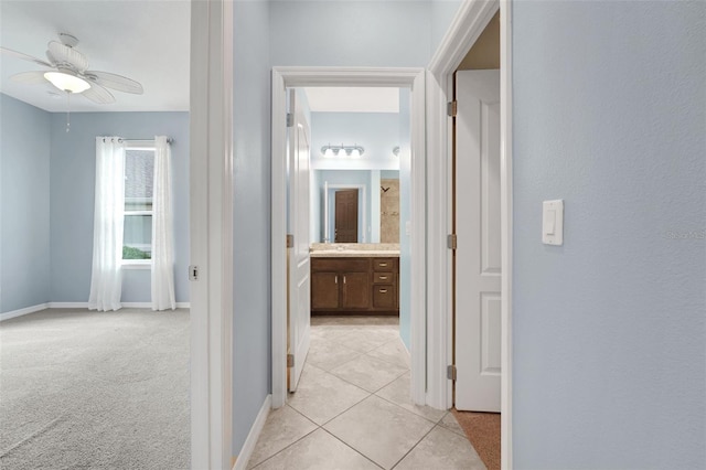 7540 Bishop Square Dr, Winter Garden, FL 34787 - hall featuring light tile patterned flooring and baseboards