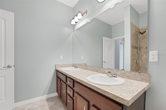 7540 Bishop Square Dr, Winter Garden, FL 34787 - full bath with double vanity, tile patterned flooring, and a tile shower