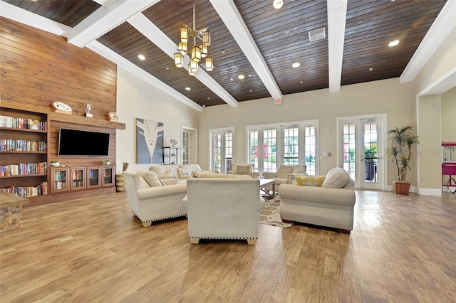 7540 Bishop Square Dr, Winter Garden, FL 34787 - living room with light wood-style floors, a wooden ceiling with exposed beams, recessed lighting, and french doors