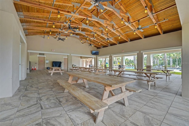 7540 Bishop Square Dr, Winter Garden, FL 34787 - dining room with high vaulted ceiling, plenty of natural light, a wooden ceiling with exposed beams, and a ceiling fan
