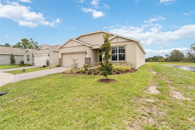 17461 Back Bay Ct, Clermont, FL 34714 - ranch-style house with driveway, stucco siding, an attached garage, a front yard, and a water view