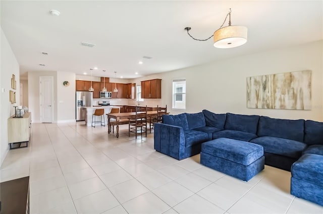 17461 Back Bay Ct, Clermont, FL 34714 - living area with light tile patterned floors and recessed lighting