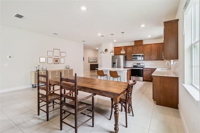 17461 Back Bay Ct, Clermont, FL 34714 - dining area featuring light tile patterned floors and recessed lighting