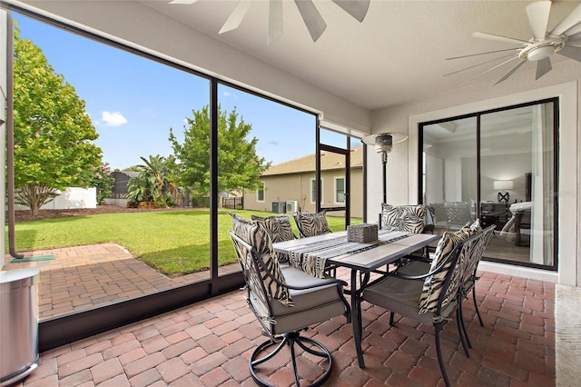 1406 Deuce Cir, Champions Gate, FL 33896 - sunroom featuring a ceiling fan and outdoor dining space