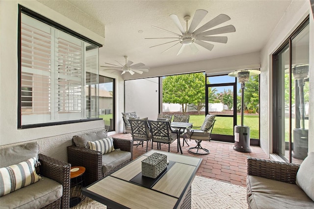 1406 Deuce Cir, Champions Gate, FL 33896 - sunroom / solarium featuring outdoor dining space, ceiling fan, and an outdoor hangout area