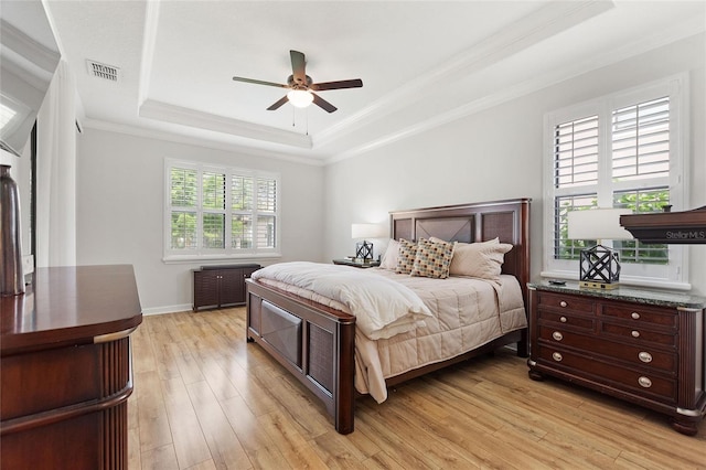 1406 Deuce Cir, Champions Gate, FL 33896 - bedroom featuring a raised ceiling, crown molding, light wood-style flooring, and a ceiling fan